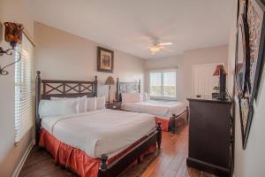 a bedroom with two beds and a window at Legacy Tower I in Gulfport +58 photos