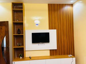 a flat screen tv on a wall in a room at Villa Diamaguene in Ngaparou