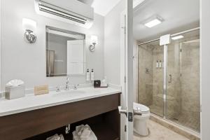 a bathroom with a sink and a toilet and a shower at The Water Street Inn in Ephraim +70 photos