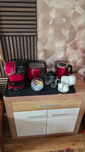 a kitchen counter with pots and pans on it at Golden Leaf Apartment with Parking in Burghausen