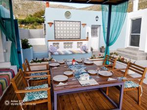 a table and chairs on a patio at Kareshome-Privacy-view in Kalymnos