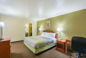 Postel nebo postele na pokoji v ubytování Motel 6-Livingston, TX