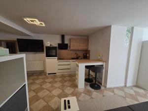 a kitchen with a desk and a counter top at Cosy Studio CatHouse in Radovljica