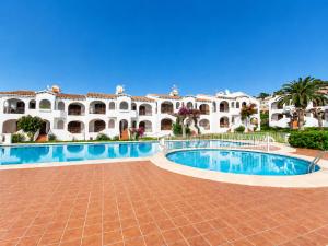 a view of the courtyard of a villa with a swimming pool at Turquoise Menorca By the Sea in Son Bou