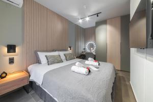 a bedroom with a bed with two teddy bears on it at Friendly Backyard in Thessaloniki