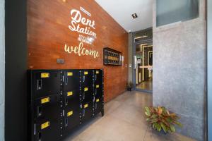a room with a bunch of lockers in a building at Dent Station Residence in Ban Suan