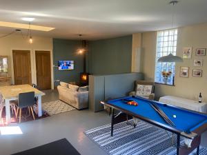 a living room with a pool table in it at The Blue Lodge in Galway