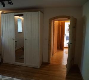 a hallway with a door leading into a room at Landidyll Am Eisenberg in Kirchberg