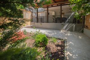 a porch of a house with a patio at Friendly Backyard in Thessaloniki