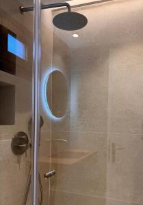 a shower with a glass door and a ceiling at Christaras Apartments in Vourvourou +44 photos