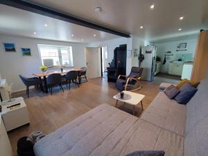 a living room with a couch and a table at Ferienhaus Quell in Sankt Martin
