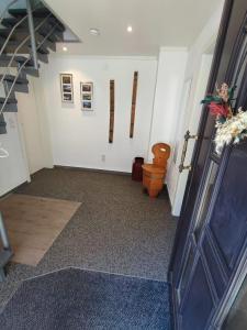 a hallway with white walls and a stair case at Ferienhaus Quell in Sankt Martin