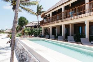 a villa with a swimming pool and a resort at Beachfront Villa Soliman Bay- 8 bedrooms in Balcheil