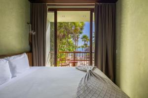 a bedroom with a bed and a view of a balcony at Beachfront Villa Soliman Bay- 8 bedrooms in Balcheil +40 photos