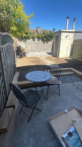 a patio with a table and two chairs at Dublin 12 house in Dublin