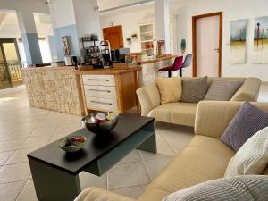 a living room with two couches and a table at Seaview Luxury Penthouse Mare in Sal Rei