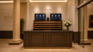 a wine tasting room with a display of wine bottles at Hotel Bellas Artes in Mexico City