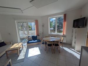 a living room with a table and a couch at Apartman Amanda in Poděbrady