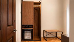 a closet in a room with a wooden door at Hotel Bellas Artes in Mexico City