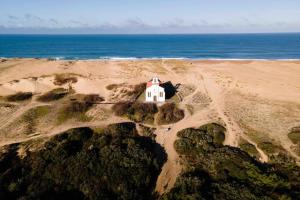 a small house on a beach near the ocean at Labenne beach apartment in Labenne