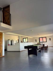 a large room with a pool table in it at Chez Diarra in Saint-Louis