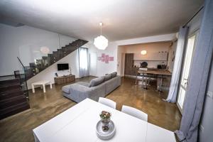 a living room with a couch and a table at Villa Elen in Marsala