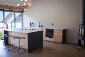 a kitchen with a counter with a sink and a stove at Reed Panorama in Reed