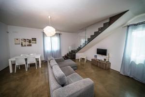 a living room with a couch and a table at Villa Elen in Marsala