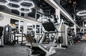 a gym with several treadmills and machines at Apartamenty Nad Suwalskim Bulwarem in Suwałki