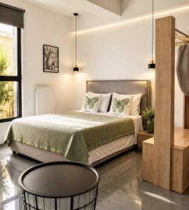 a bedroom with a large bed and a table at ATHENIAN Vibes in Athens