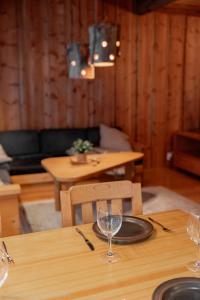 a table with two wine glasses on top of it at Kelo Haven, 2 x skipasses Ruka-Pyhä included, skibus nearby in Ruka