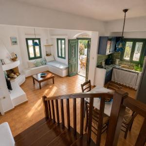 a large living room with a table and a kitchen at Niriedes Villas in Leipsoi +195 photos