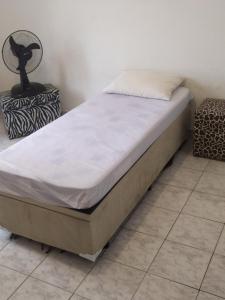 a bed sitting on top of a room with at Conexão SP in São Paulo