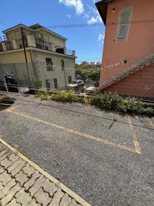 an empty parking lot in front of a building at Le Cinque Terre da Pippo in La Spezia