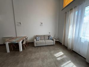 a living room with a couch and a table at Le Cinque Terre da Pippo in La Spezia