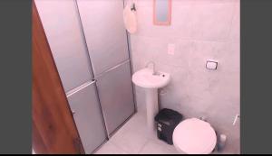 a small bathroom with a toilet and a sink at Conexão SP in São Paulo +35 photos