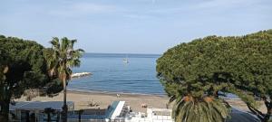a view of a beach with a boat in the water at StellinAmare in Sestri Levante
