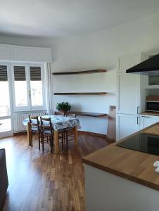 a kitchen and dining room with a table and chairs at StellinAmare in Sestri Levante +8 photos