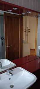 a bathroom with a sink and a large mirror at StellinAmare in Sestri Levante