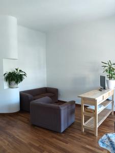 a living room with a couch and a table at StellinAmare in Sestri Levante