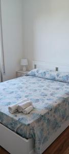 a bedroom with a bed with two towels on it at StellinAmare in Sestri Levante