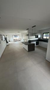 a large room with a large white room with windows at Maison 3 chambres in Avignon +8 photos