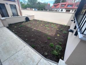 a garden on the side of a building at Mezonet Jarková in Prešov