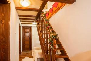 a stairway with a christmas wreath on it at Вила Соколето in Sokolovtsi