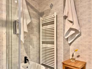 a bathroom with a sink and a shower at Chalet San Primo in Castiglione dʼIntelvi +12 photos