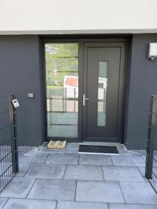 a door of a house with at Cozy & small apartment-Böblingen in Böblingen