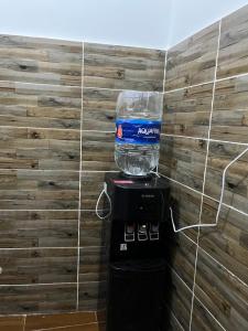 a fishtank on top of a water cooler in a room at Farida Nile view in Luxor +14 photos
