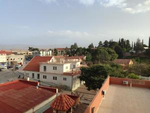 an overhead view of a city with buildings and trees at Ryad dar midelt in Midelt