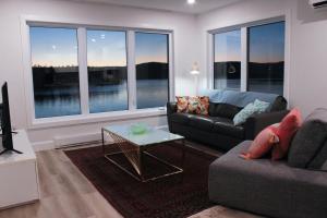 a living room with a couch and a table at The View in French Village