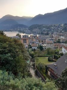 a view of a city with mountains in the background at Casa Marina in Omegna